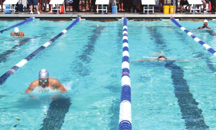 Boys swim the opening lap of the 100 meter breaststroke at the OBC championships. PHOTOS/KEN JACKSON