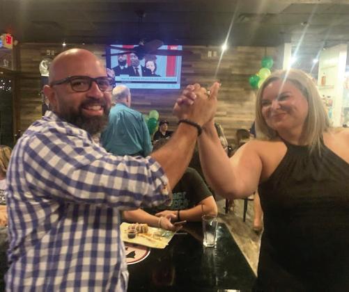 Will Fonseca, with Kissimmee City Commission seat winner Janette Martinez, on primary election night, is in a Nov. 8 runoff for the School District district 4 seat against Heather Kahoun. PHOTO/NATALIE FEDOR