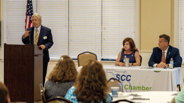 State Reps. Paula Stark and Fred Hawkins appeared with St. Cloud Chamber of Commerce President Dirk Webb at a pair of Chamberhosted legislative update events last week on the heels of the session recently ending. PHOTO/GARRETT CASTO