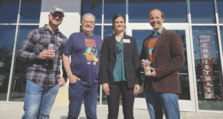 Citrus Kiss is the brainchild of Celebration Brewing Company’s Frank Lozito (left, with Experience Kissimmee CEO D.T. Minich, Health Start of Osceola County Executive Director Kerri Stephen and Experience Kissimmee Chief of Destination Stewardship Jason Holic), as proceeds from its sale will go to help new parents in Osceola County. PHOTOS/KEN JACKSON