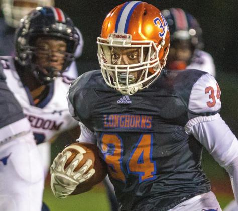 Tyler Emans rushed for 203 yards and scored three touchdowns as the Harmony Longhorns came from 14 points down to defeat Mt. Dora, 35-34, last week. PHOTO/ROB HERBERT