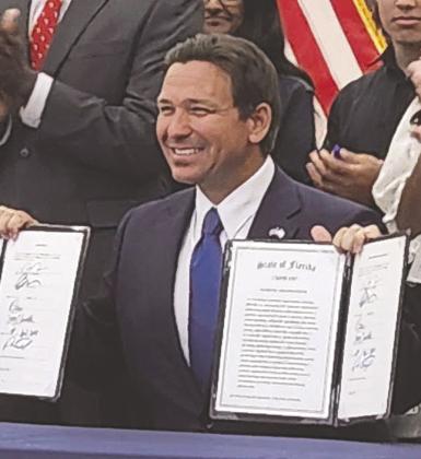 Gov. Ron DeSantis came to Kissimmee in April to sign a bill allowing for chaplains programs and other organizations on school campuses. But Osceola County's School Board couldn't approve a plan to allow the chaplains on campus in 2024. PHOTO/KEN JACKSON