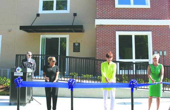 City of Kissimmee, Osceola County and Park Place Behavioral officials cut the ribbon on Dillingham Apartments, a facility in a case-managed setting. PHOTO/KEN JACKSON