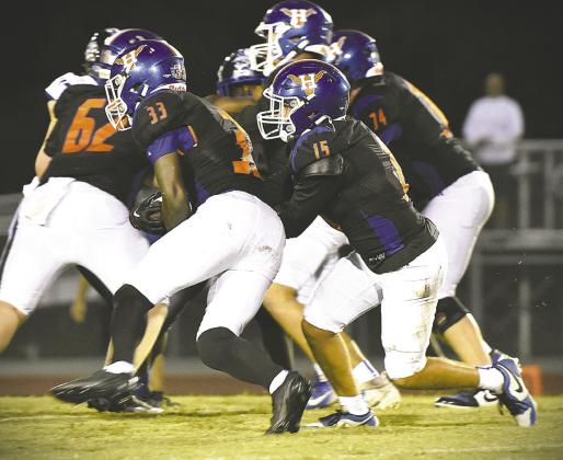 Harmony’s Damarion Moore (33), shown in the Longhorns’ win over Sebastian River Sept. 5, scored a pair of touchdowns in Friday’s 39-6 victory over Clewiston. (Photo/Katie Williams)