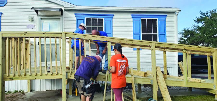 The Osceola Council on Aging and The Home Depot Foundation Team, along with the Helping Homebound Heroes, teamed up on Veterans Day to build wheelchair ramps for Veterans living in Kissimmee and St. Cloud. PHOTO/OSCEOLA COUNCIL ON AGING