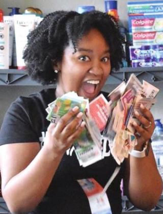 “Krys the Maximizer” showing off the key to her maximizing with a fat stack of coupons. PHOTO/KRYSTAL SHARP