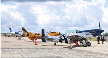 Kissimmee Gateway Airport business Stallion 51’s lineup of vintage military aircraft, along with a United Airlines regional passenger jet, were among the headliners of Kissimmee Gateway Airport’s open house event Saturday. PHOTO/TERRY LLOYD
