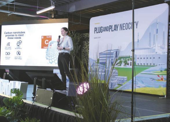 Katy Jinkins, PhD, CEO and Co-founder of SixLine Semiconductor, explains how carbon nanotubes will be used in next-gen electronics at a Plug And Plug-hosted NeoCity expo Oct. 24. PHOTO/TERRY LLOYD