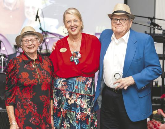 From left, Joyce Lemmond, Chris Hougland, and Bo Lemmond at the recent OCOA Havana Nights Gala, receiving the Volunteer of the Year Award. PHOTO/OSCEOLA COUNCIL ON AGING