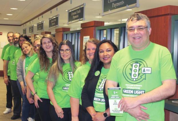 Osceola Clerk of Court Kelvin Soto and Director of Criminal Court Operations Catherine Smith (at right) and their staff are ready to assist Osceola residents with unpaid fees save money through Operation Green Light. PHOTO/KEN JACKSON