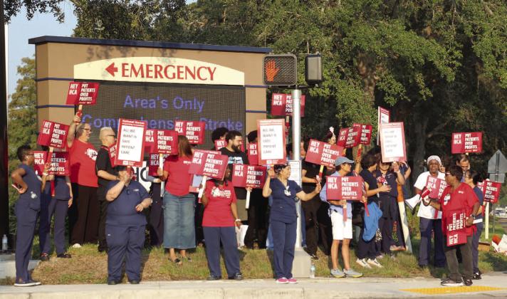 HCA Florida Osceola Hospital nurses picket regarding contract negotiations outside the facility Thursday morning. PHOTO/NATIONAL NURSES UNITED