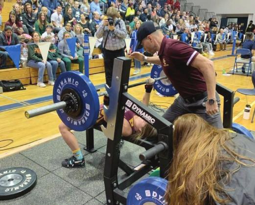 PHOTO/ST. CLOUD WEIGHTLIFTING St. Cloud senior Kaylin White successfully lifts 150 pounds in the bench press to help her capture the FHSAA State Championship in the 110-pound weight class.