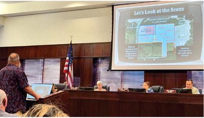 Mark Rambis makes a presentation to County Commissioners against the potential site for a green energy manufacturing site at Monday’s public comment meeting. PHOTO/KEN JACKSON