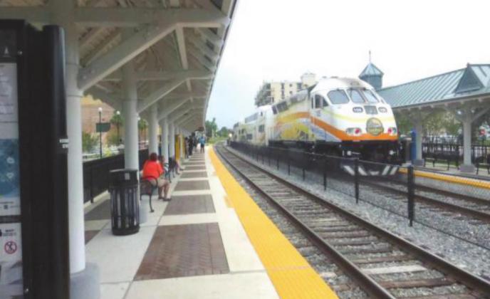 A northbound SunRail train pulls into the Kissimmee station. Osceola County will take over its local operations in July 2024, and must decide this year how to transition. FILE PHOTO