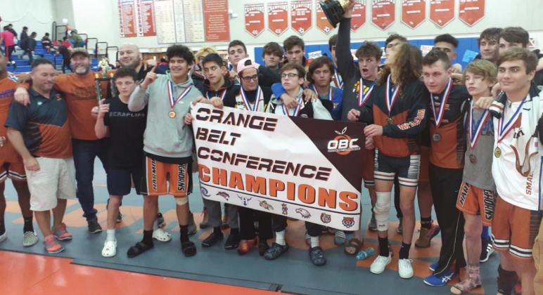 Harmony wrestlers and coaches celebrate the school's first OBC Wrestling Championship in school history, upending long-time champion Osceola in the process. NEWS-GAZETTE PHOTO/J. DANIEL PEARSON
