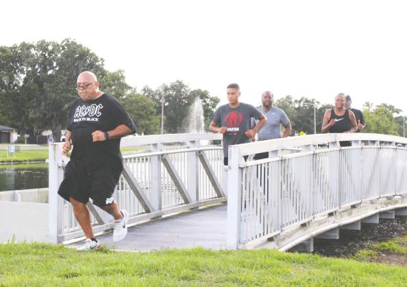 Team BLUFOR members completed a multi-event Red, White, &amp; Blue Trifecta Mission Saturday at the St. Cloud Lakefront. (Photo/Terry Lloyd)