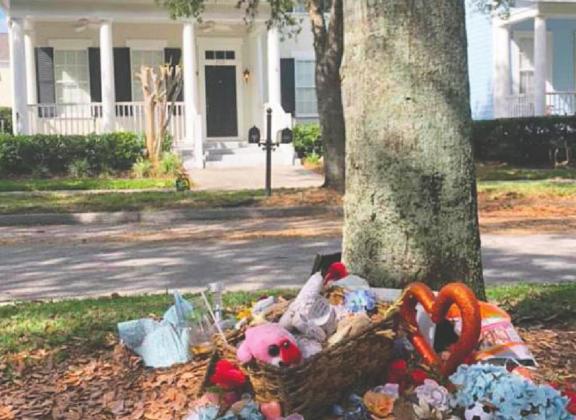 Community members placed stuffed animals and other memorial items in front of the Celebration home where Anthony Todt is accused of killing his family. PHOTO/FACEBOOK