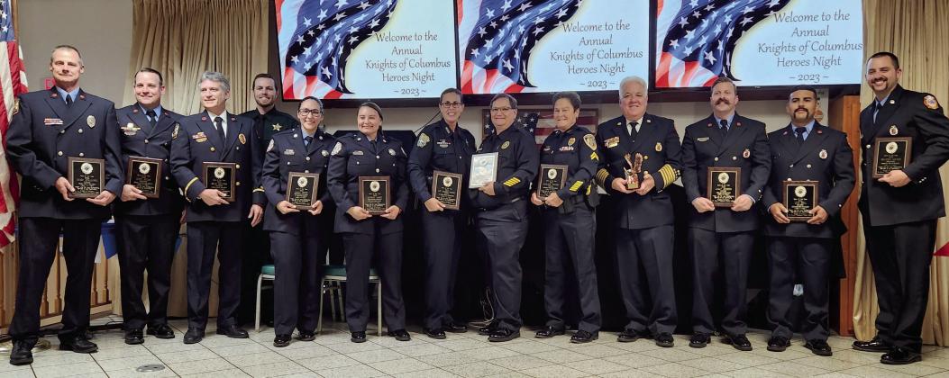 Recipients of the Knights of Columbus accept their Heroes of the Year awards on Feb. 15. PHOTO/KEN JACKSON