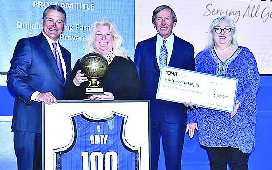 Pictured from left: Orlando Magic CEO, Alex Martins, OCOA President & CEO Wendy Ford, Orlando Magic Chairman, Dan DeVos and OCOA Grants Manager Lisa Wright. PHOTO/OSCEOLA COUNCIL ON AGING