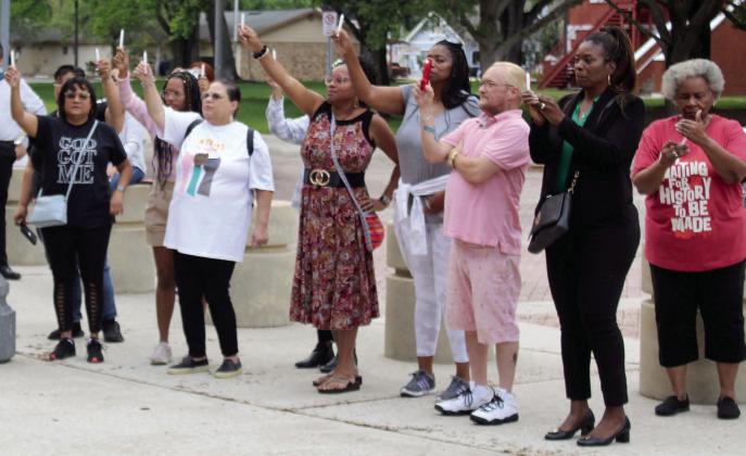 Community leaders and members gathering Monday night to remember those lost to gun violence, and implore lawmakers to craft stronger gun legislation. PHOTO/KEN JACKSON