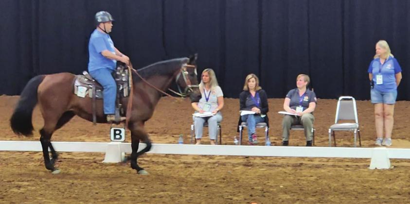 A Special Olympics USA Games contestant puts his horse through its paces during equestrian practice Tuesday at the Silver Spurs Arena. Competition runs through Friday and is open to the public. PHOTO/KEN JACKSON