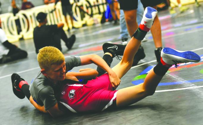 Despite robust programs at a couple of schools, the School District of Osceola County will no longer sponsor wrestling, along with softball and golf, as part of its middle school sports slate. PHOTO/KATIE WILLIAMS