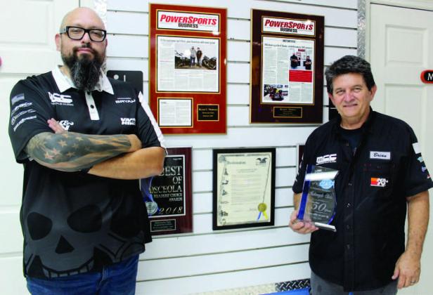 Brian Dady (right) and Bryan Montoya keep The Motorcycle Clinic in Kissimmee rolling. The business was honored for 50 years of service with the city’s Ruby Award. PHOTO/KEN JACKSON