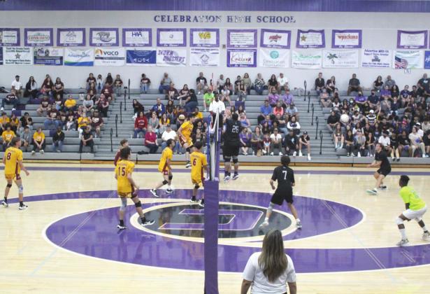 Celebration volleyball libero Keith Harrison, pictured in neon yellow at right, in the District 11 championship match against St. Cloud in May, is the News-Gazette’s Boys Volleyball Player of the Year. PHOTO/KEN JACKSON