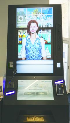 Sara, Central Florida’s first AI bartender, wears the same outfit as other live bartenders at the Wyndham Resort and Conference Center/Celebration. PHOTO/MARIO CASAMALHUAPA