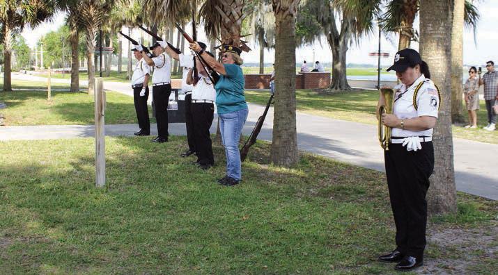 Osceola County Veterans Council Color Guard and American Legion Post 10 Commander Dianne Ritchey performs a gun salute at March 29’s Vietnam veterans memorial. PHOTOS/TERRY LLOYD