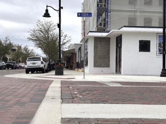 Despite a lengthy streetscaping project completed last year in downtown St. Cloud, newly-bricked streets feature gaps, dips, potholes and the sand base level rising to the surface in some vulnerable places like this on 10th Street. PHOTOS/THOMAS OUELLETTE