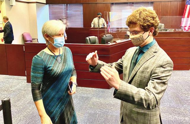 Noah Ziegler, 16, at right, talks with Commissioner Cheryl Grieb after the County Commission meeting on Monday. Grieb appointed Ziegler to the Library Advisory Board during the meeting, making him the first minor ever appointed to a county advisory board. NEWS-GAZETTE PHOTO/BRIAN MCBRIDE