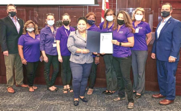 County Commissioners proclaimed October as Domestic Violence Awareness Month on Monday. Commissioners are pictured along with members of Help Now, the certified domestic violence center that has provided services for survivors and the children who witness domestic violence in Osceola County for the past 38 years. PHOTO/OSCEOLA COUNTY