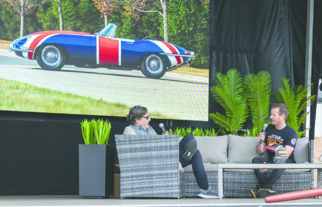 The 1967 Jaguar E-Type driven by Mike Myers in the three Austin Powers movies went for $880,000, and open-wheel Indy Cars sold for more than anticipated to the delight of bidders. PHOTO/TAYLOR MCFEE