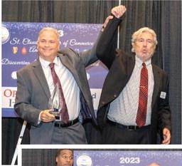 Outgoing St. Cloud Chamber Chairman Robb Larson (left) bestowed the Chairman's Award to Chamber President Dirk Webb. PHOTOS/CAPTURE WITH CASTO