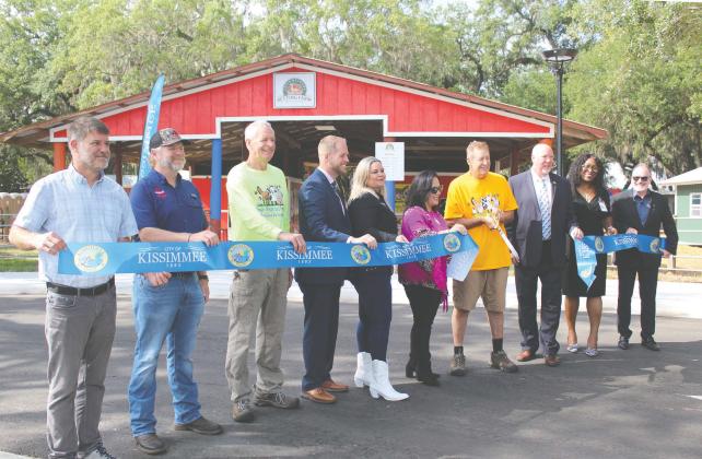 City of Kissimmee officials cut the ceremonial ribbon on Lancaster Ranch Park Tuesday, which includes a new location for longtime area attraction Green Meadows Petting Farm. PHOTO/KEN JACKSON