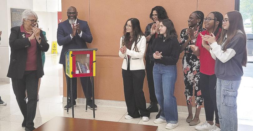 Early Learning Coalition of Osceola County, City of Kissimmee, Osceola School District and Valencia College officials were on hand for the unveiling of a Little Free Library on campus June 26. PHOTO/OSCEOLA READS