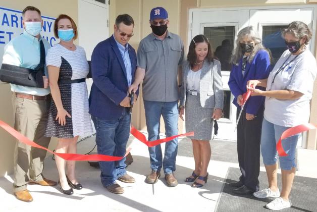 County and SNip-It Clinic officials cut the ribbon Monday at the Harmony Vet Clinic. PHOTOS/KEN JACKSON