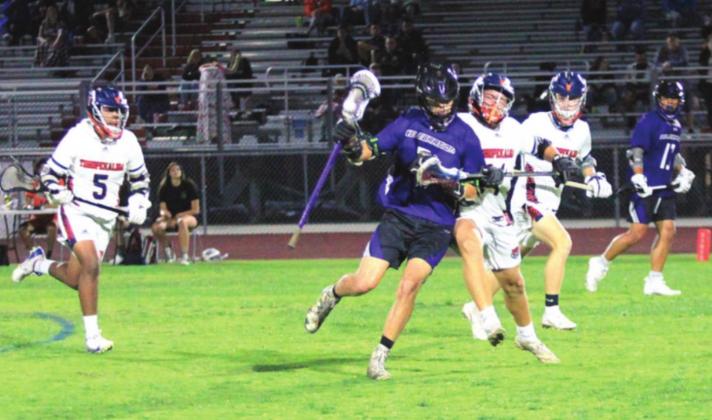 Celebration’s Zach Zelmanski carries the ball against Tohopekaliga in Thursday’s match of the county rivals. PHOTO/TIM ZELMANSKI