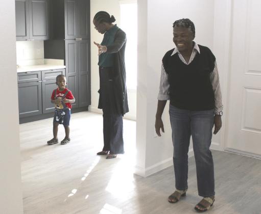 Friday, new homeowners Tannique and Quarlisa toured their new Kissimmee homes, built in two weeks through Habitat for Humanity Greater Orlando &amp; Osceola County’s “Builders Blitz.” PHOTOS/KEN JACKSON