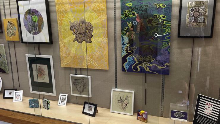 Buenaventura Lakes Library’s display of local Art is part of Art in Public Places with Osceola Arts. PHOTO/CHRIS MILLER