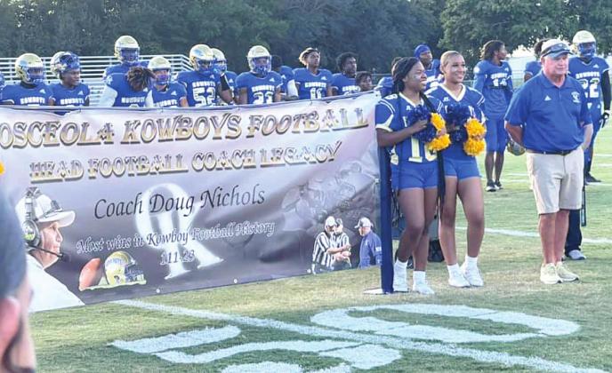 Prior to Osceola’s win Friday over Windermere, former Coach Doug Nichols, who led the Kowboys to nine straight district titles, was honored as OHS’ all-time winningest coach. PHOTO/JOHN VOGT