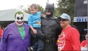 News-Gazette Photo/NaNcy briGham James Potocnak, 6, is with The Joker (Steve Kleiner), Batman (John Kalish) and St. Cloud Mayor Nathan Blackwell.