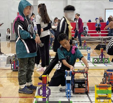 Members of one of the Osceola Science Charter School VEX World Championships robotics teams puts its models through its paces ahead of next week’s competition. PHOTO/MING HENRY