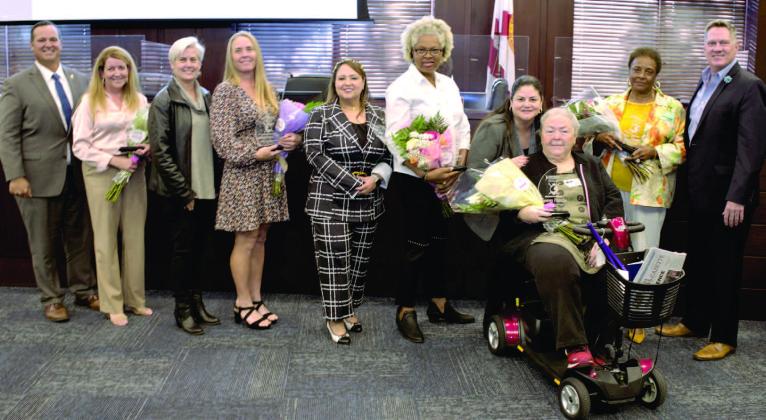 2023 Woman Warrior Award winners with County Commissioners, from left: Commissioner Ricky Booth and Debbie Henderson, Commissioner Cheryl Grieb and Dr. Tara Gaston, Commissioner Viviana Janer and Doreen Edwards-Baker, Commissioner Peggy Choudhry and Gwenn Paracha, Peggy Rivers and Commissioner Brandon Arrington. PHOTO/OSCEOLA COUNTY