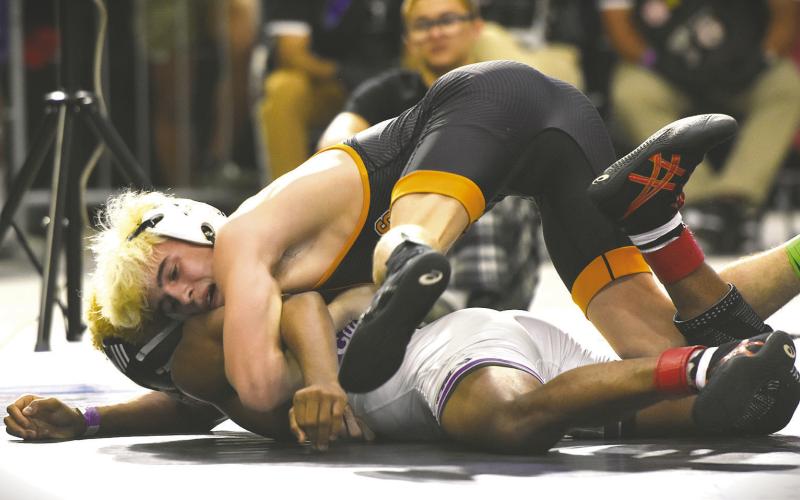 Harmony’s Nathan Lyttle entered the Class 3A 120-pound championship match at 48-0, but after a hard-fought bout, Miami Southwest’s Lazaro Soto took a 3-2 decision. (Photos/Katie Williams)