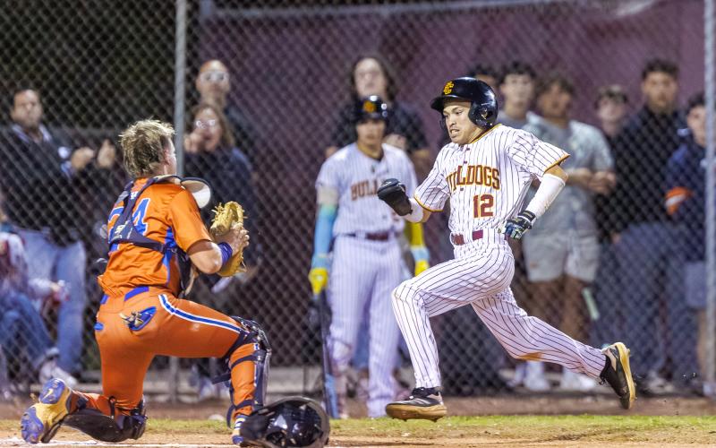 Harmony catcher Ayden Fayne makes the play at the plate, keeping St. Cloud's Nick Acevado from scoring in the close game St. Cloud would pull out, 3-2. (Photo/Taylor McFee)