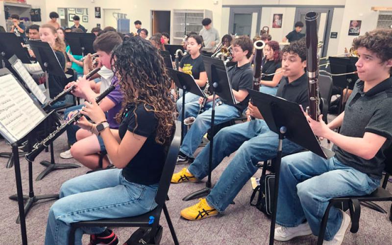 Osceola County School for the Arts’ Wind Ensemble rehearses Monday ahead of next week’s trip to suburban Washington, D.C. for the President’s Cup National High School Concert Band Invitational. The band will appear with the U.S. Army Band. (Photo/Ken Jackson)