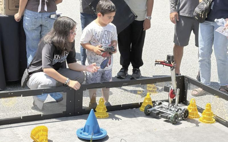 Who doesn’t love driving a remote control robot, or check out the heavens in a really big telescope? Both were on display Saturday at the NeoCity STEM Day. (Photos/Terry Lloyd)