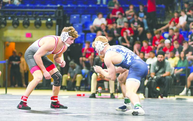 Anderson Heap (left), a three-time state champion competing for Davidson, won the Southern Conference Tournament and will become the sixth Osceola High alum to compete at the NCAA national tournament. (Photo/Davidson SID)